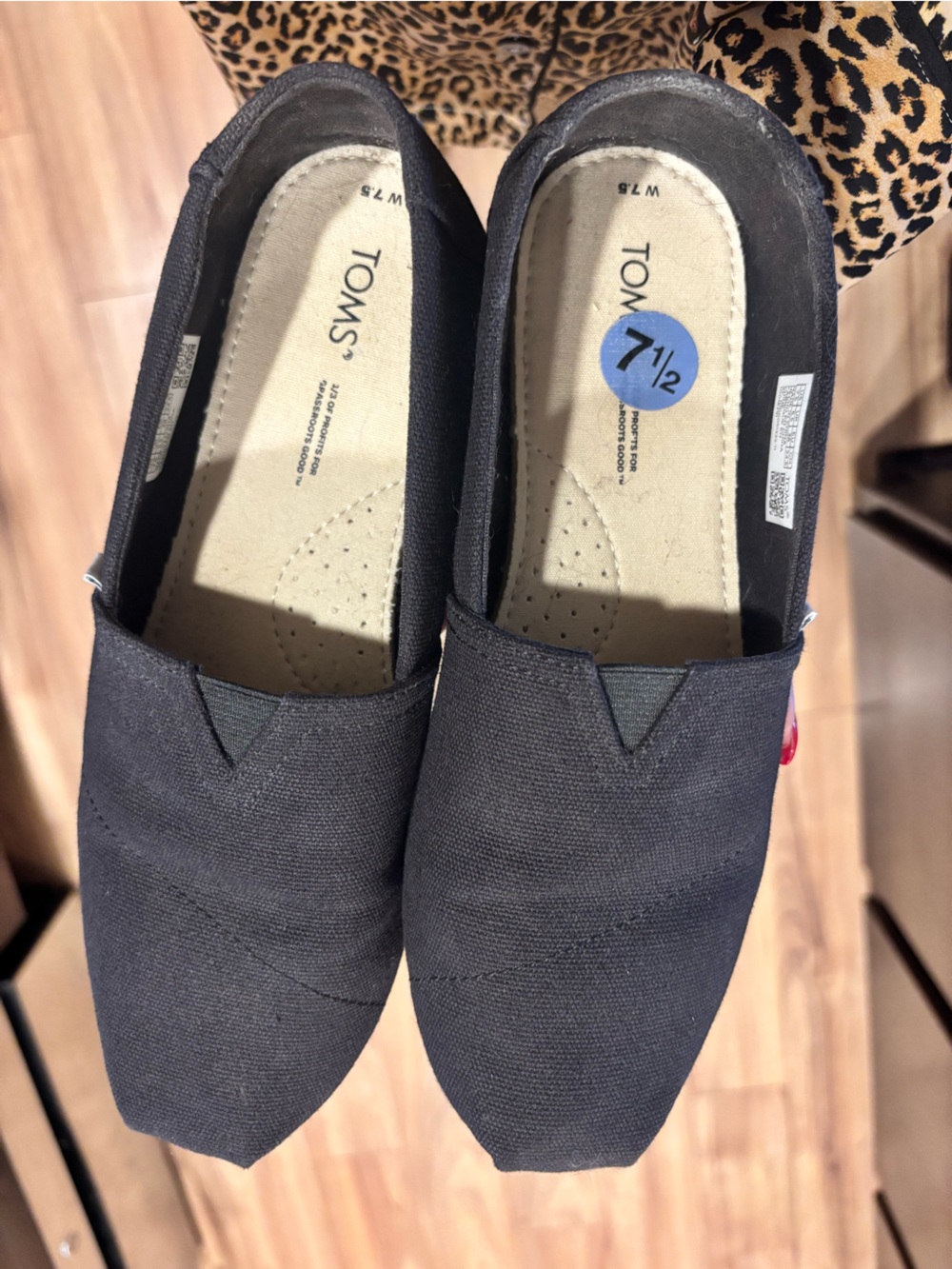 TOMS women’s Black Canvas Slip-Ons with Elastic V-Notch
